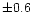 $\pm0.6$