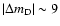 $\vert\Delta m_{\rm D}\vert\sim 9$