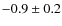 $-0.9\pm 0.2$