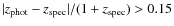 $\vert z_{\rm phot}-z_{\rm spec}\vert/(1+z_{\rm spec})>0.15$